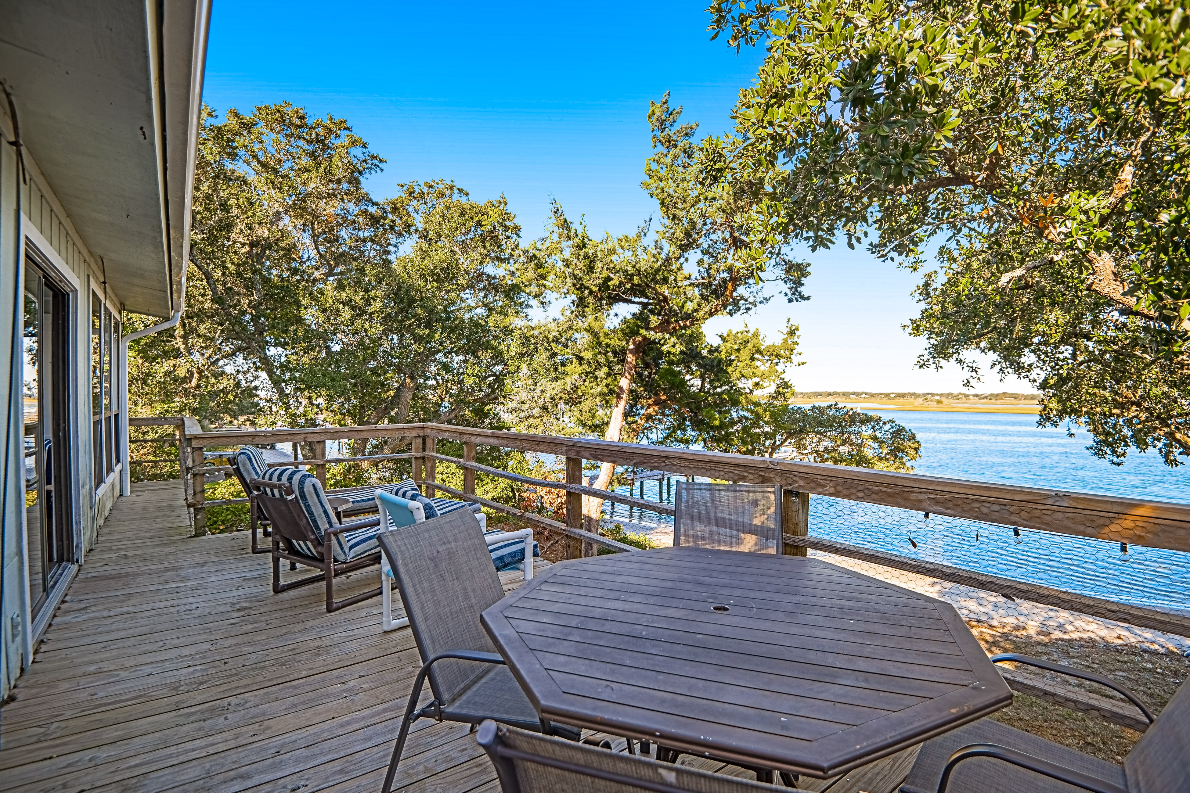 Sound-side home 200 steps from beach with water view, dock access, & deck