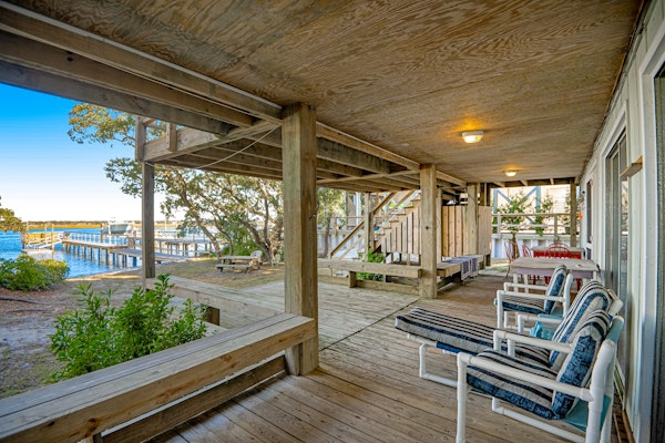 Sound-side home 200 steps from beach with water view, dock access, & deck