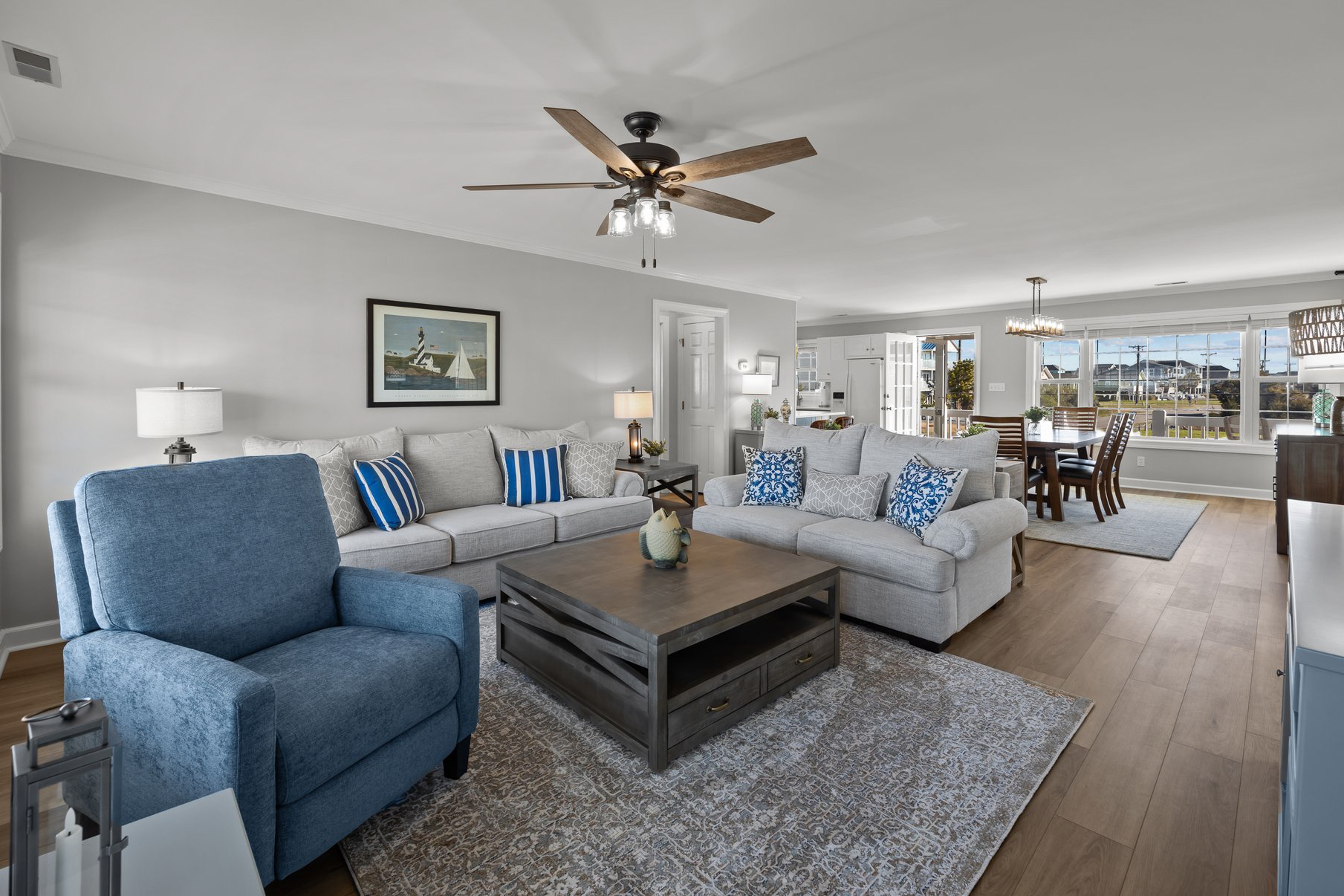 Canal front home with a floating dock and large deck with sound views