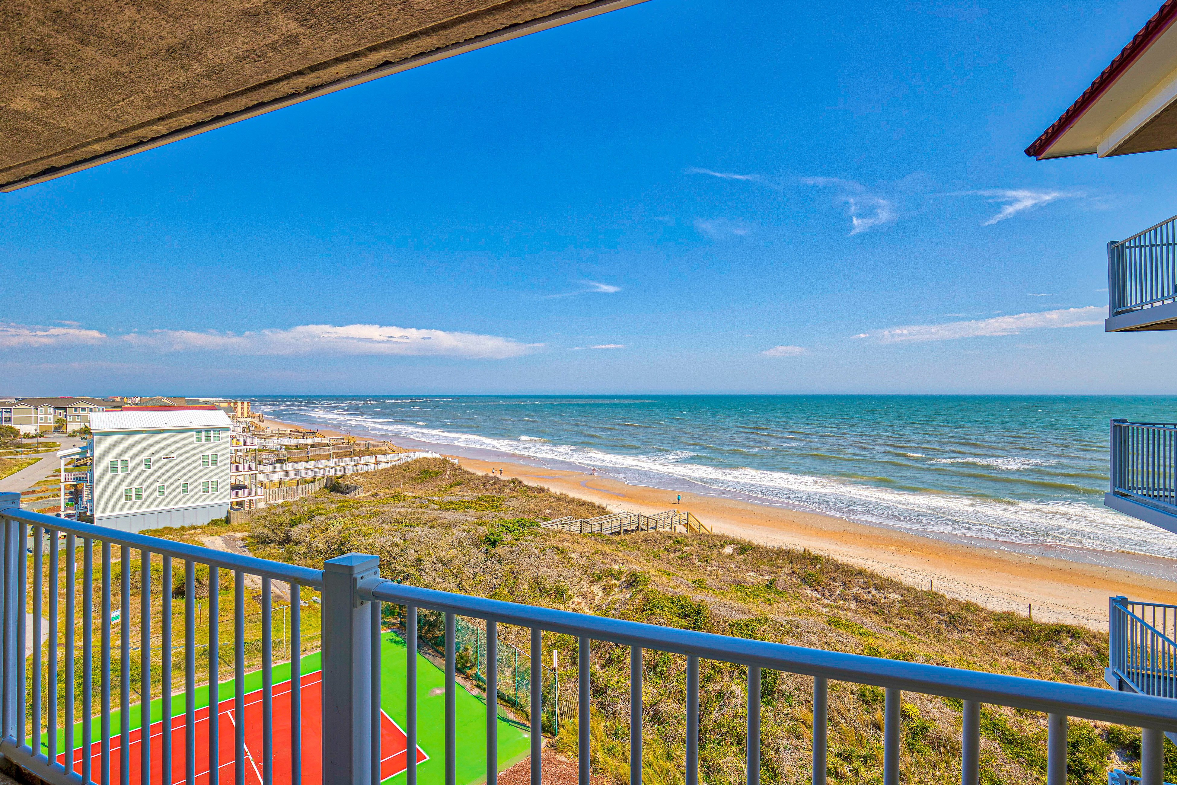 Deluxe St. Regis beach condo with ocean-view balcony, pool, gym & restaurant