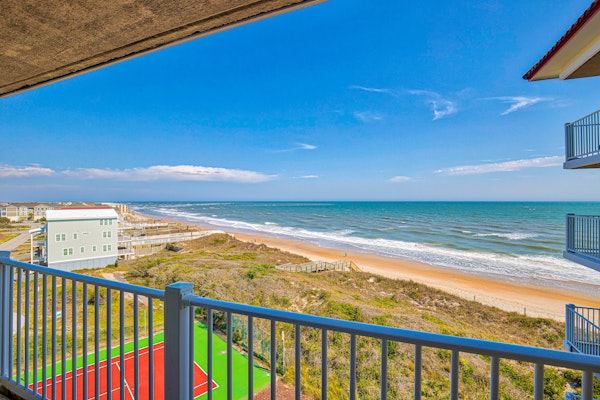 Deluxe St. Regis beach condo with ocean-view balcony, pool, gym & restaurant