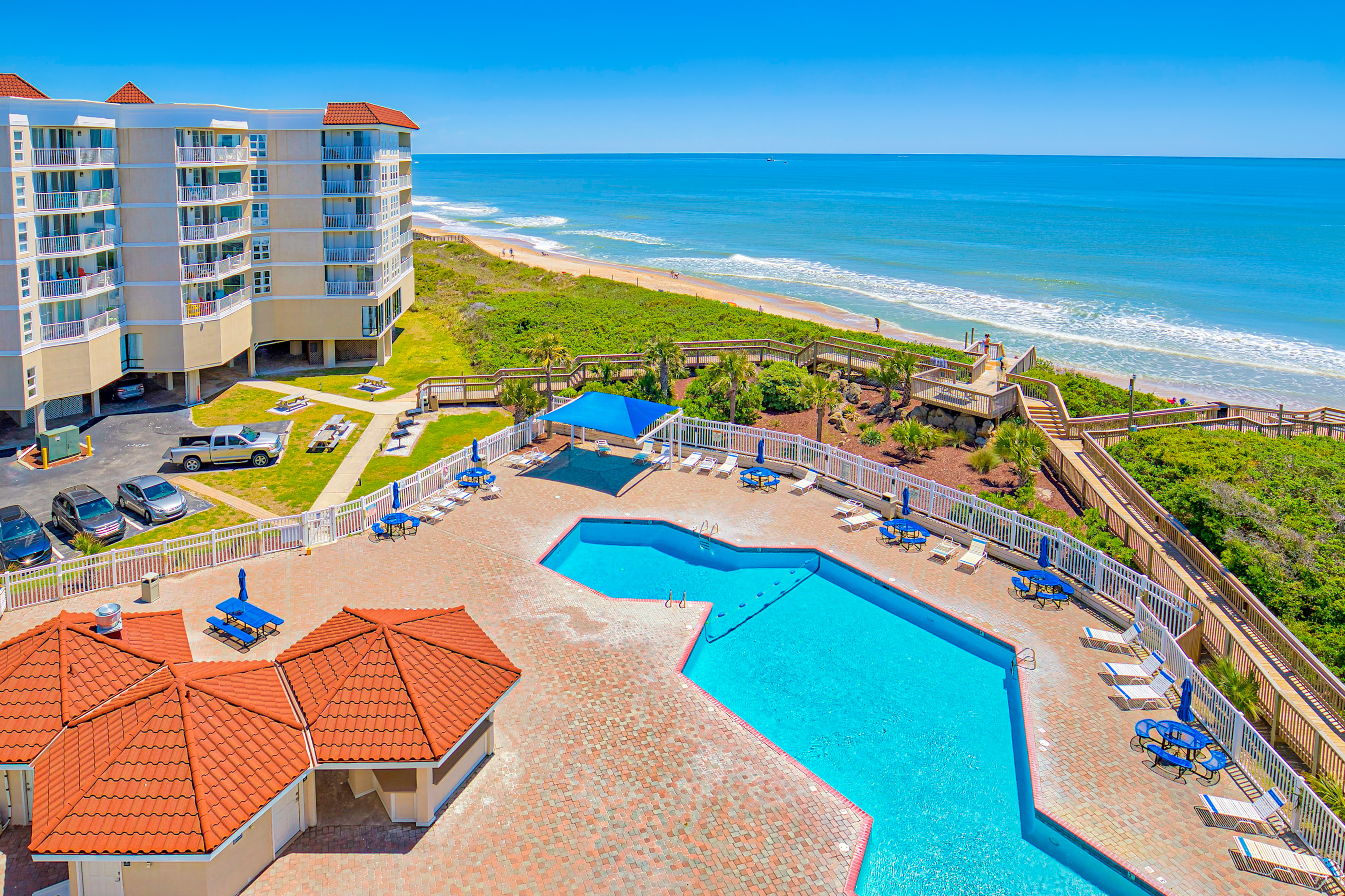 Oceanfront St. Regis condo with ocean & pool views, gym & beach access