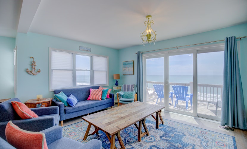 Dog-friendly duplex with ocean views, beach access, washer/dryer, central AC