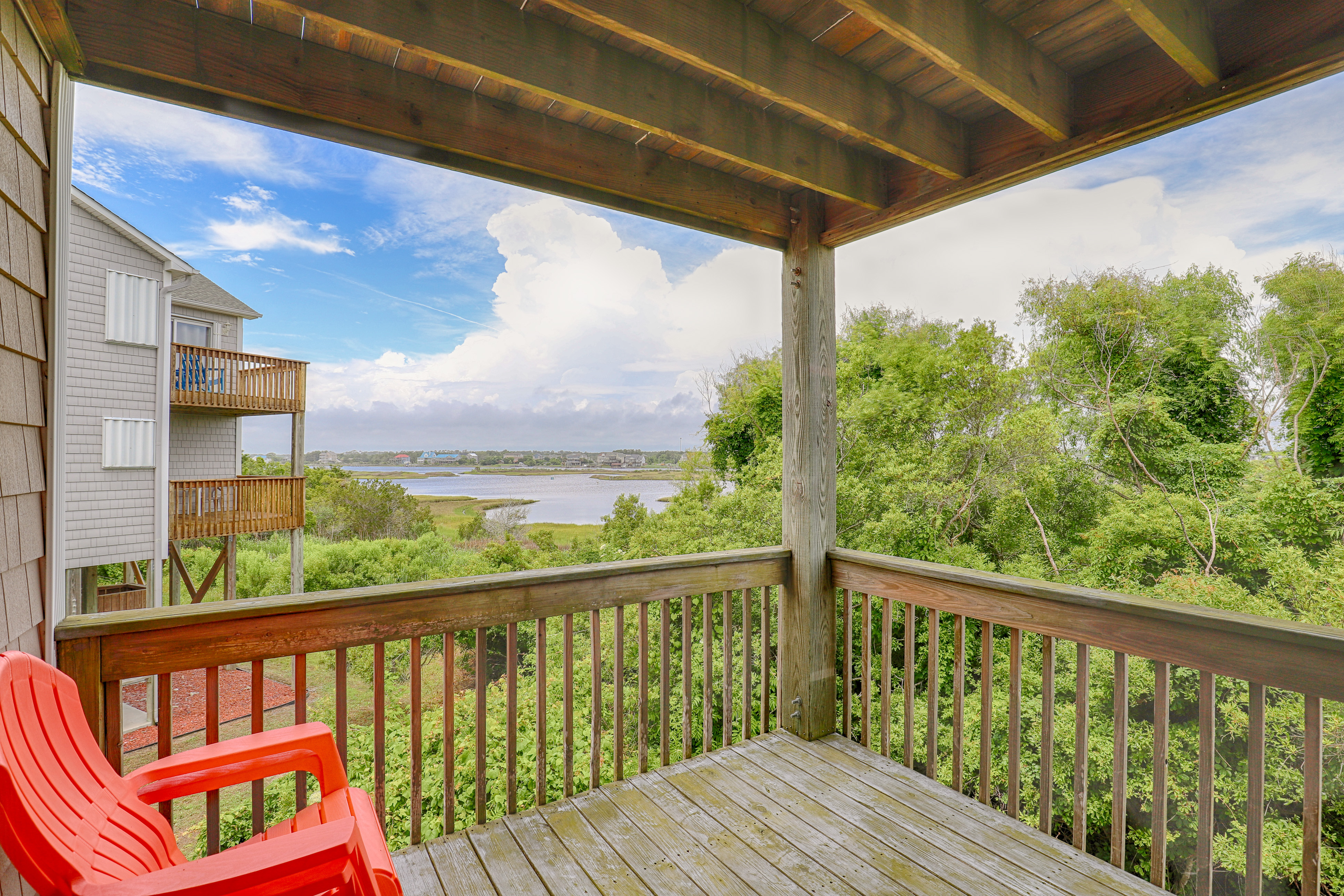 Water-view two-story duplex with multiple decks, outdoor shower, washer/dryer