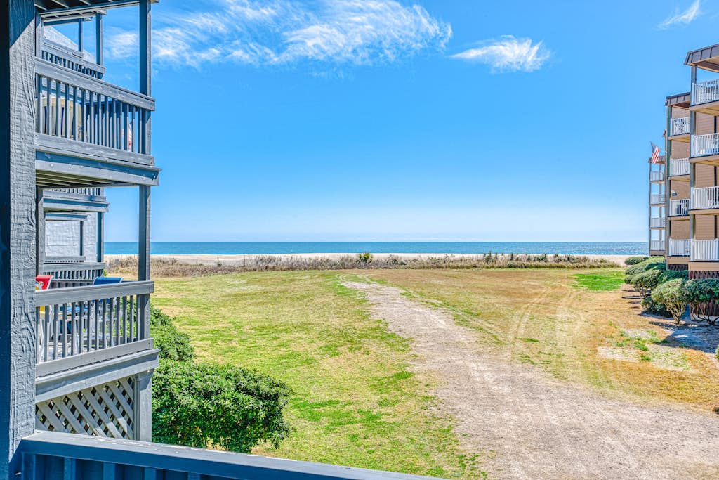 Ocean-view condo with elevator, balcony, W/D, community outdoor pool & grills