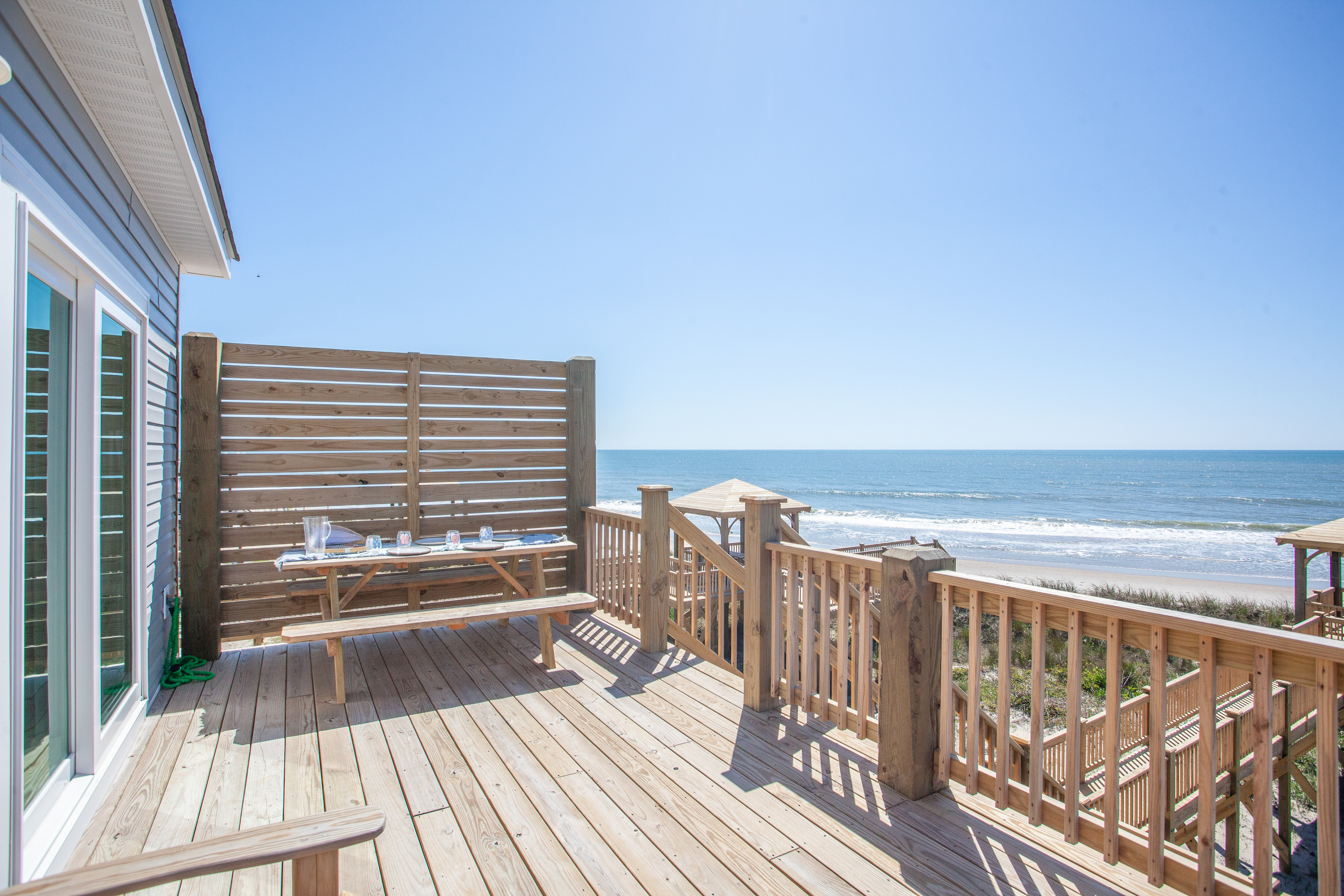 Newly built, oceanfront home with multiple decks, sunrise views & beach access