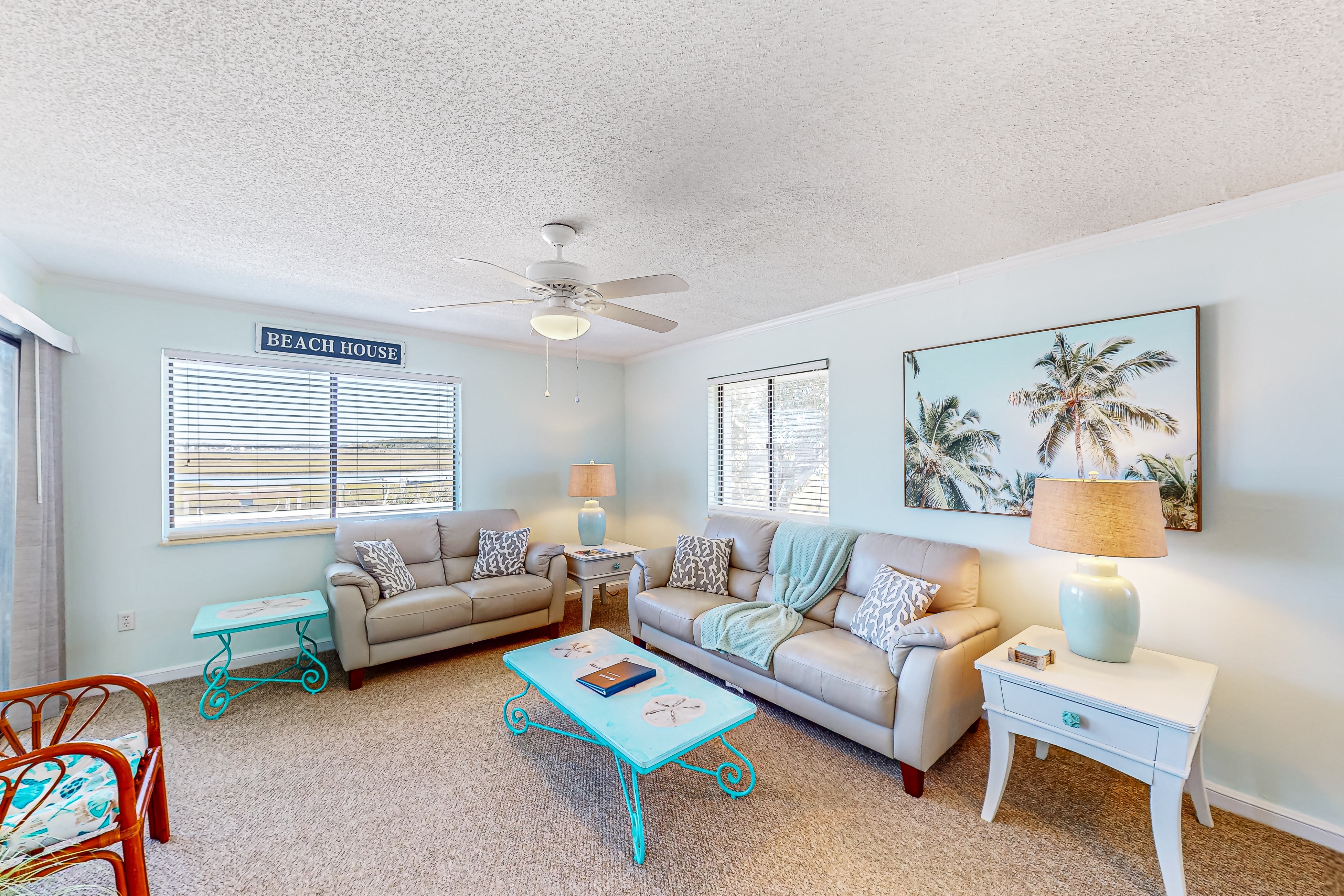 Light-filled coastal stay with open layout, water views, washer/dryer, and AC