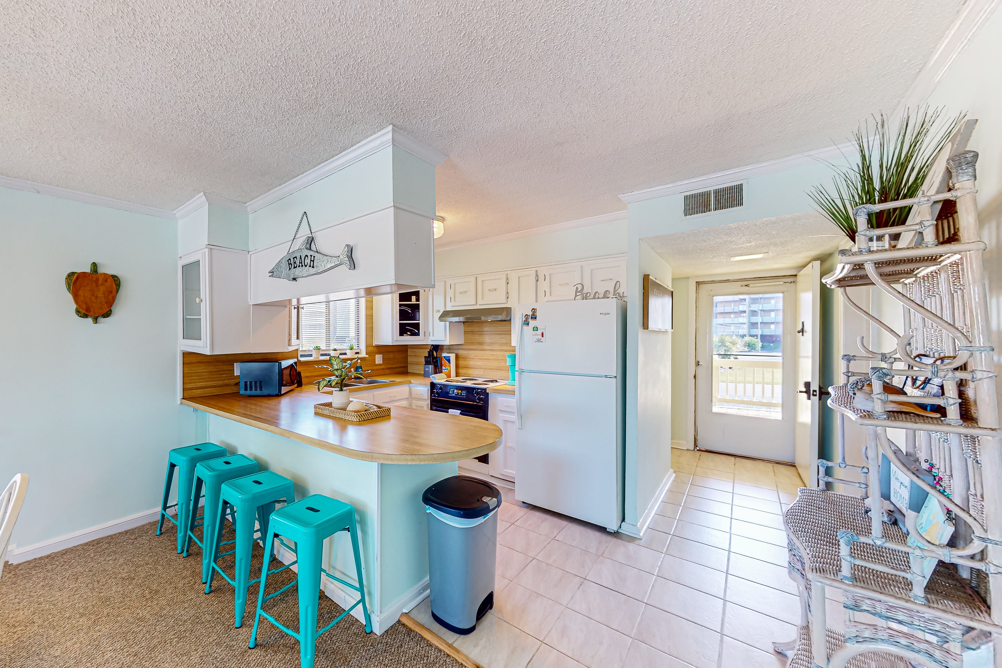 Light-filled coastal stay with open layout, water views, washer/dryer, and AC