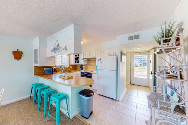 Light-filled coastal stay with open layout, water views, washer/dryer, and AC