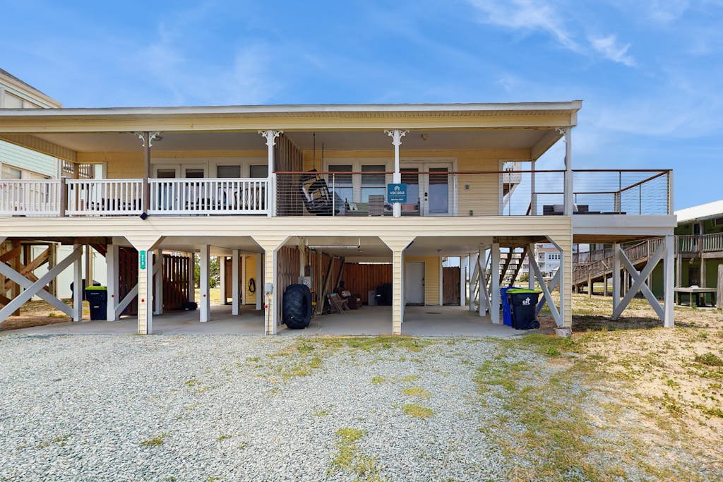 Updated home steps away from the beach with Outside Patio, Central A/C, and Wifi