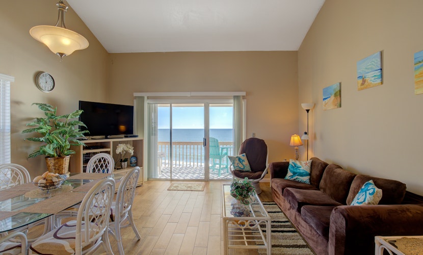 Oceanfront condo with beach views, balcony, community pool & W/D, central AC
