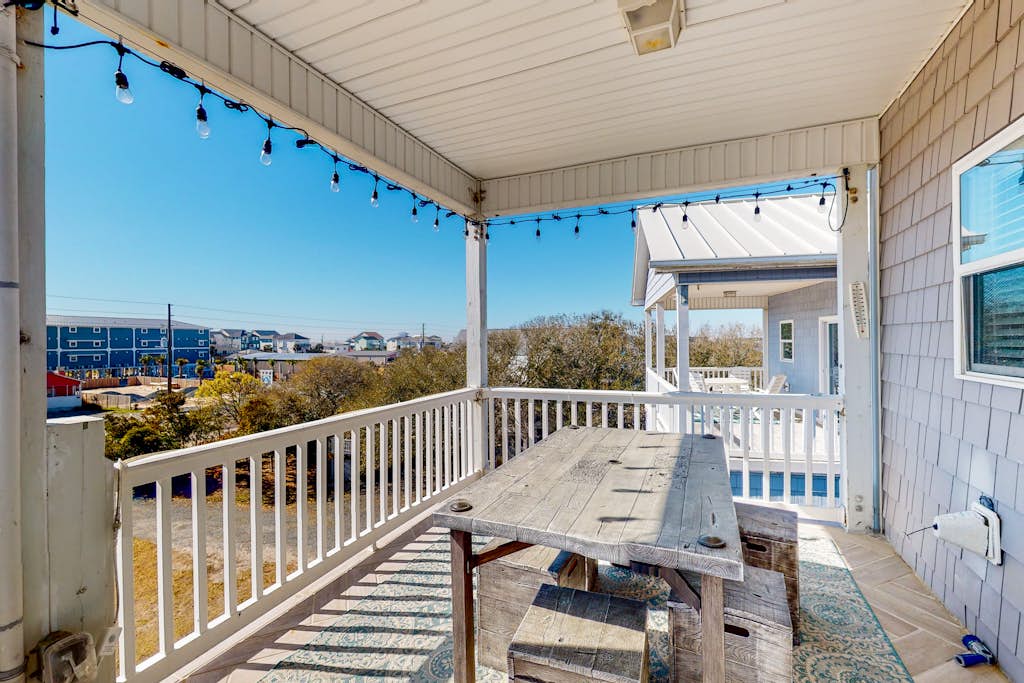 Dog-friendly, water-view home with scenic balcony, grill, washer/dryer & AC