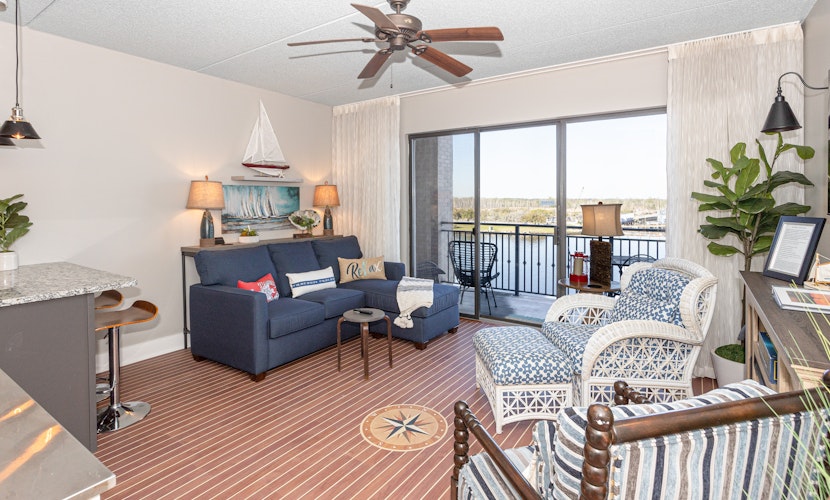 Waterfront Historic District suite with river-view balcony & walkable locale