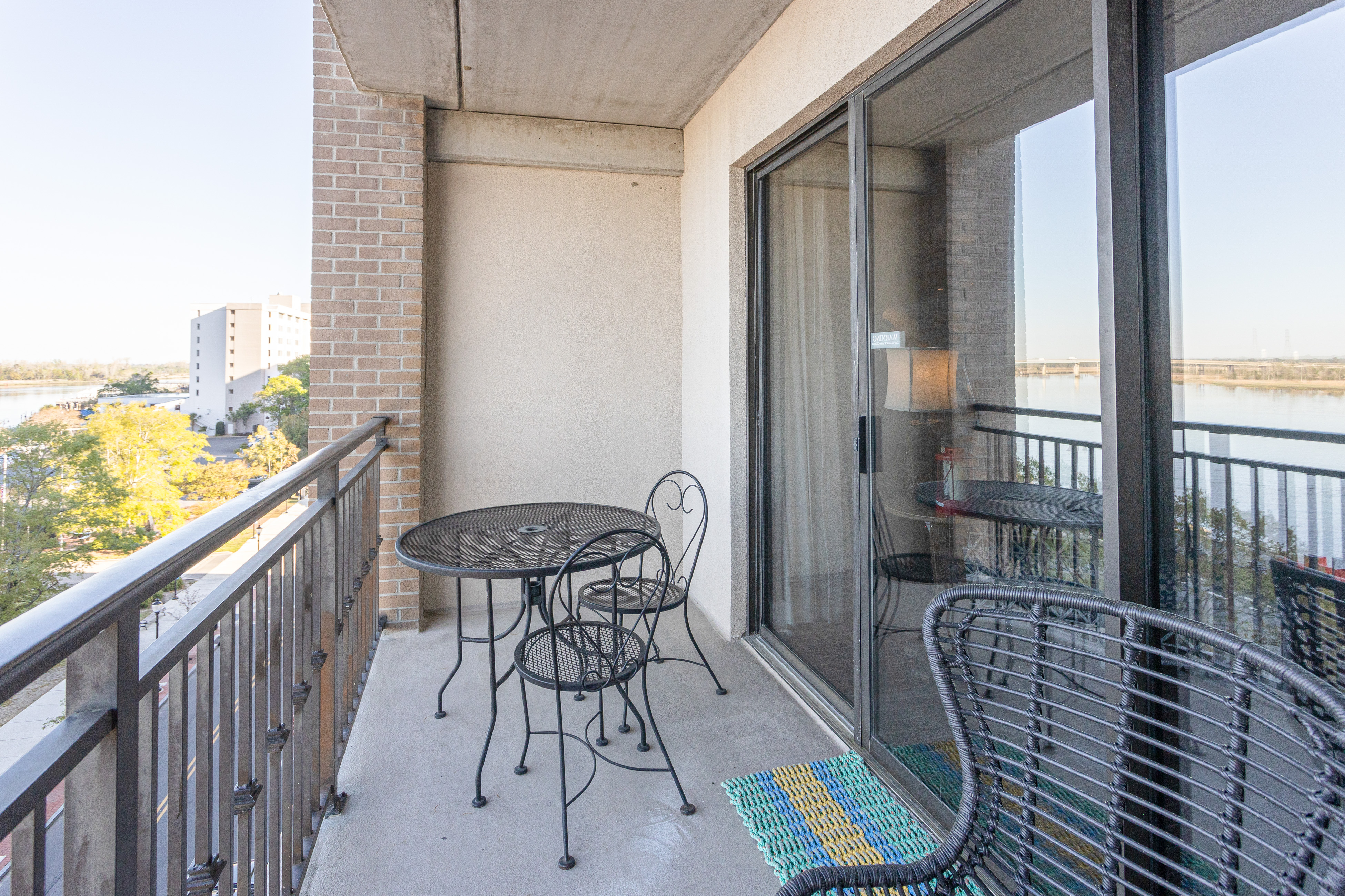 Waterfront Historic District suite with river-view balcony & walkable locale