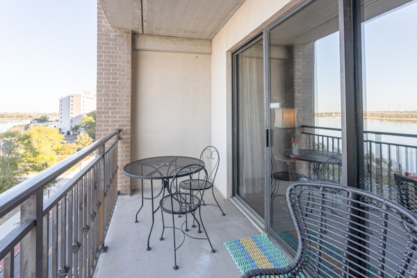 Waterfront Historic District suite with river-view balcony & walkable locale