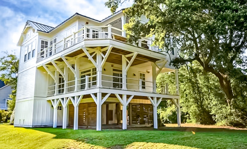 Spacious home near the coast with outdoor shower, balconies, dock access, & AC