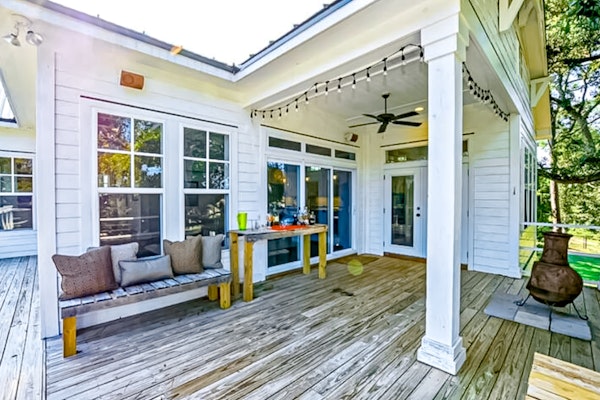 Spacious home near the coast with outdoor shower, balconies, dock access, & AC