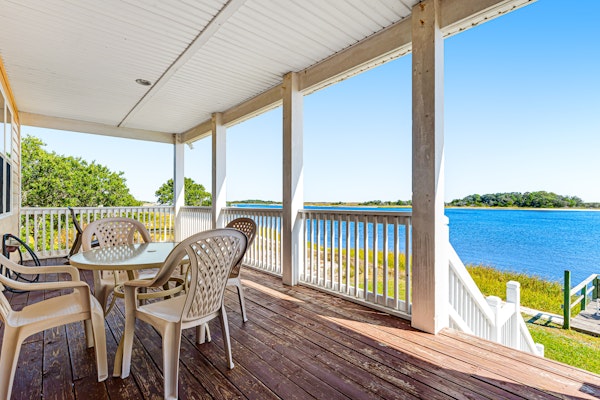 Waterfront charmer with expansive outdoor space, full kitchen, W/D, & central AC