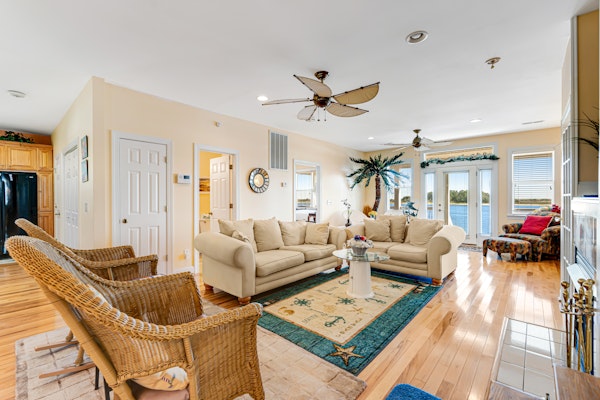 Waterfront charmer with expansive outdoor space, full kitchen, W/D, & central AC
