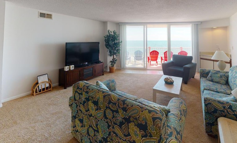 Oceanfront condo with ocean-view balconies, gym, pool & beach access