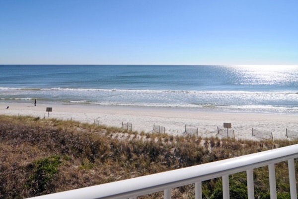 Oceanfront condo with ocean-view balconies, gym, pool & beach access