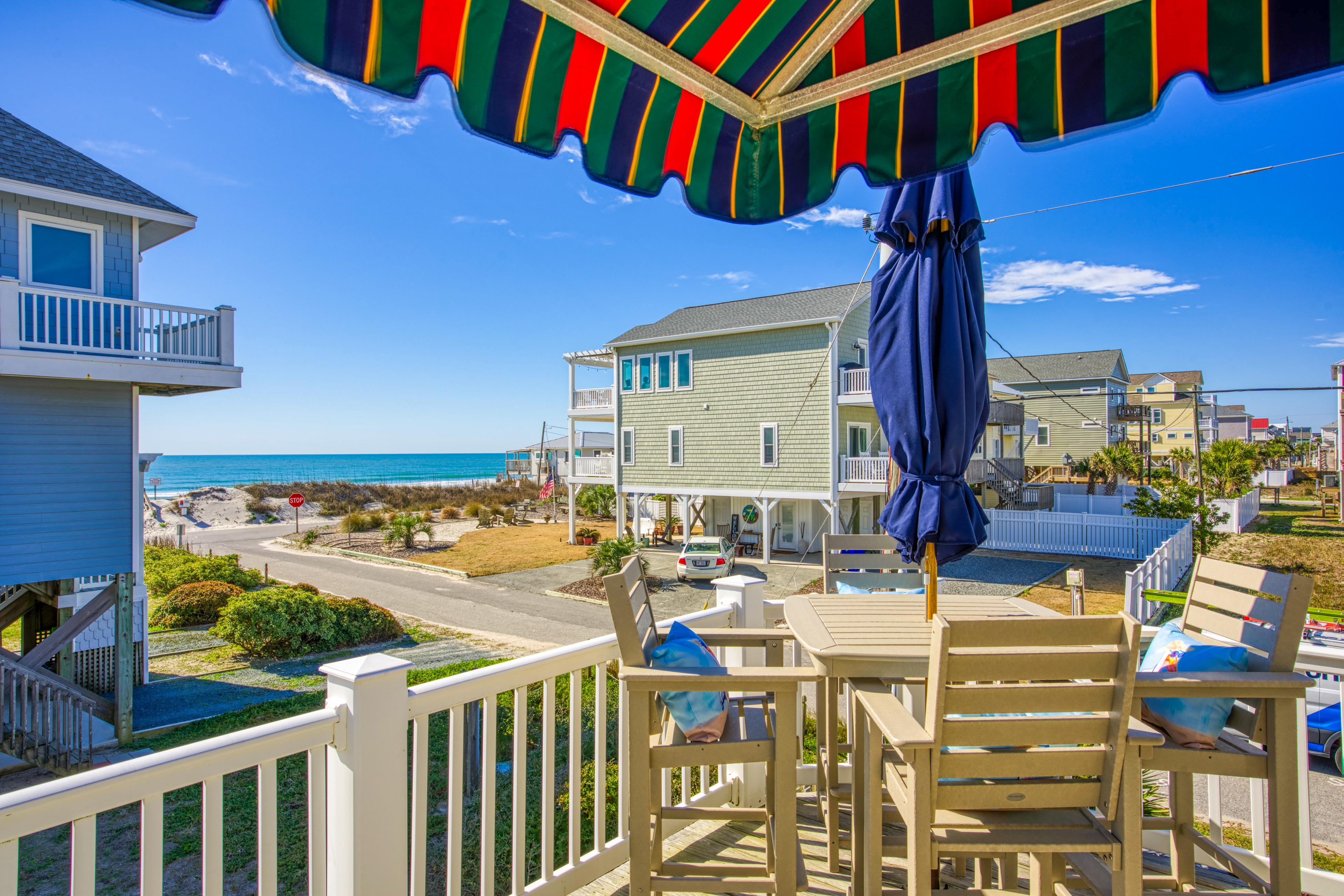 Dog-friendly beach-view home w/wraparound deck, screened porch and fenced yard