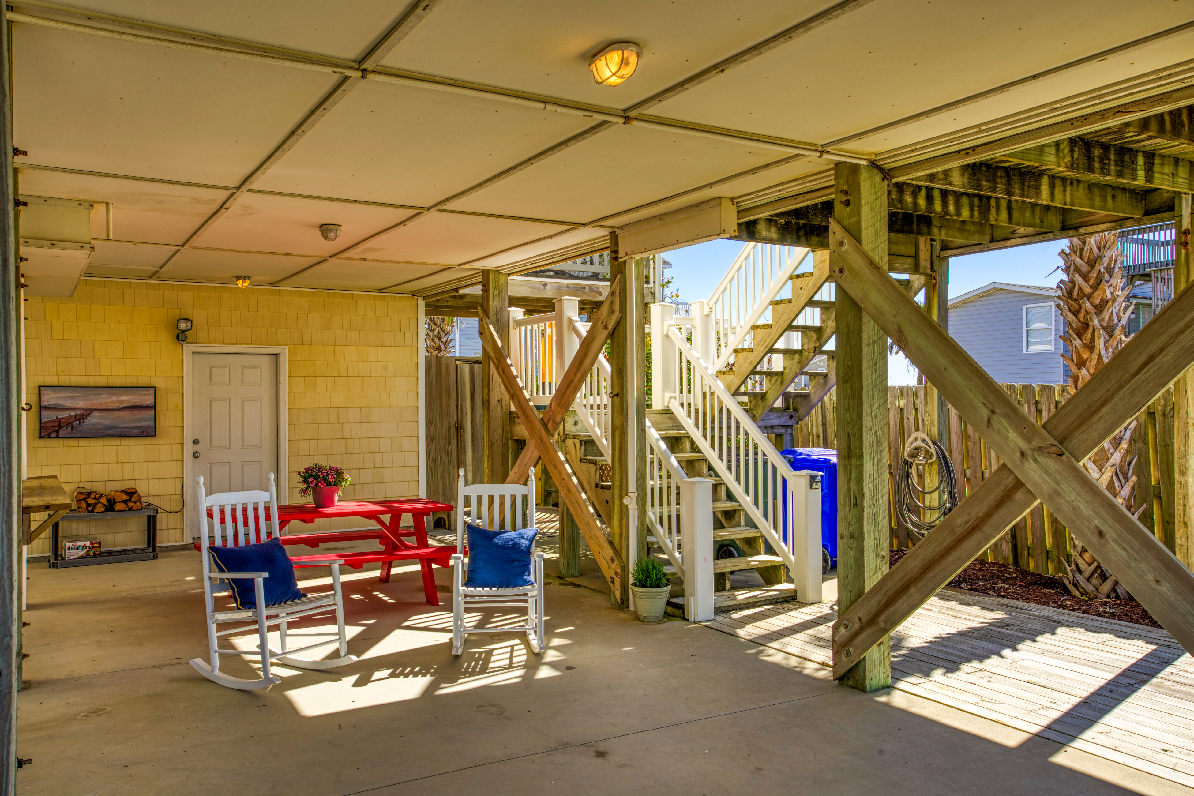 Dog-friendly beach-view home w/wraparound deck, screened porch and fenced yard