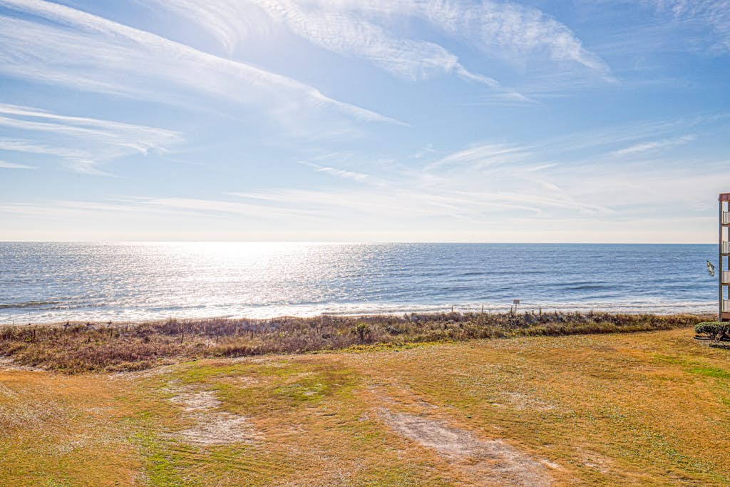 Wonderful beachfront condo with beach views, elevator, community pool & grills