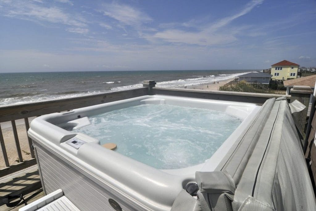 Oceanfront, dog-friendly home with hot tub, beach views & waterfront decks