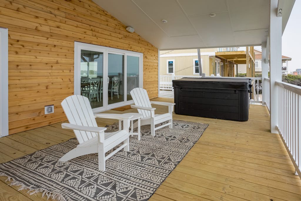 Renovated ocean-view home with beachfront access, hot tub, pool table, & deck