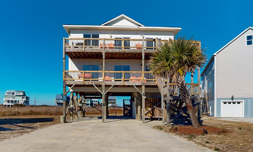 Secluded, updated, dog-friendly beach house with 360-water views, balconies & AC
