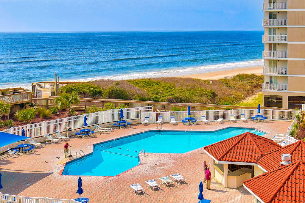 Oceanfront retreat with pool, sauna, beach access, and golf nearby