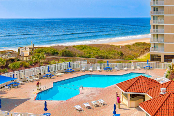 Oceanfront retreat with pool, sauna, beach access, and golf nearby