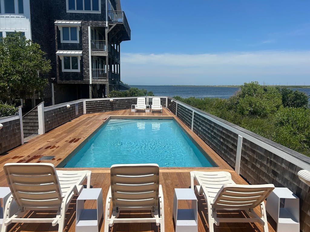 Waterfront house with private hot tub, pool, sound view, & AC - walk to dining