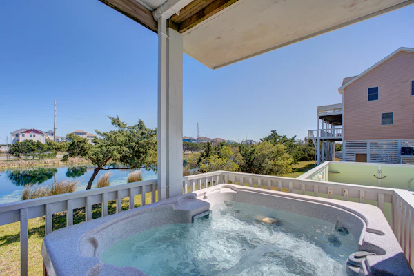 Bright, bold, & spacious home close to beach with pool & private hot tub