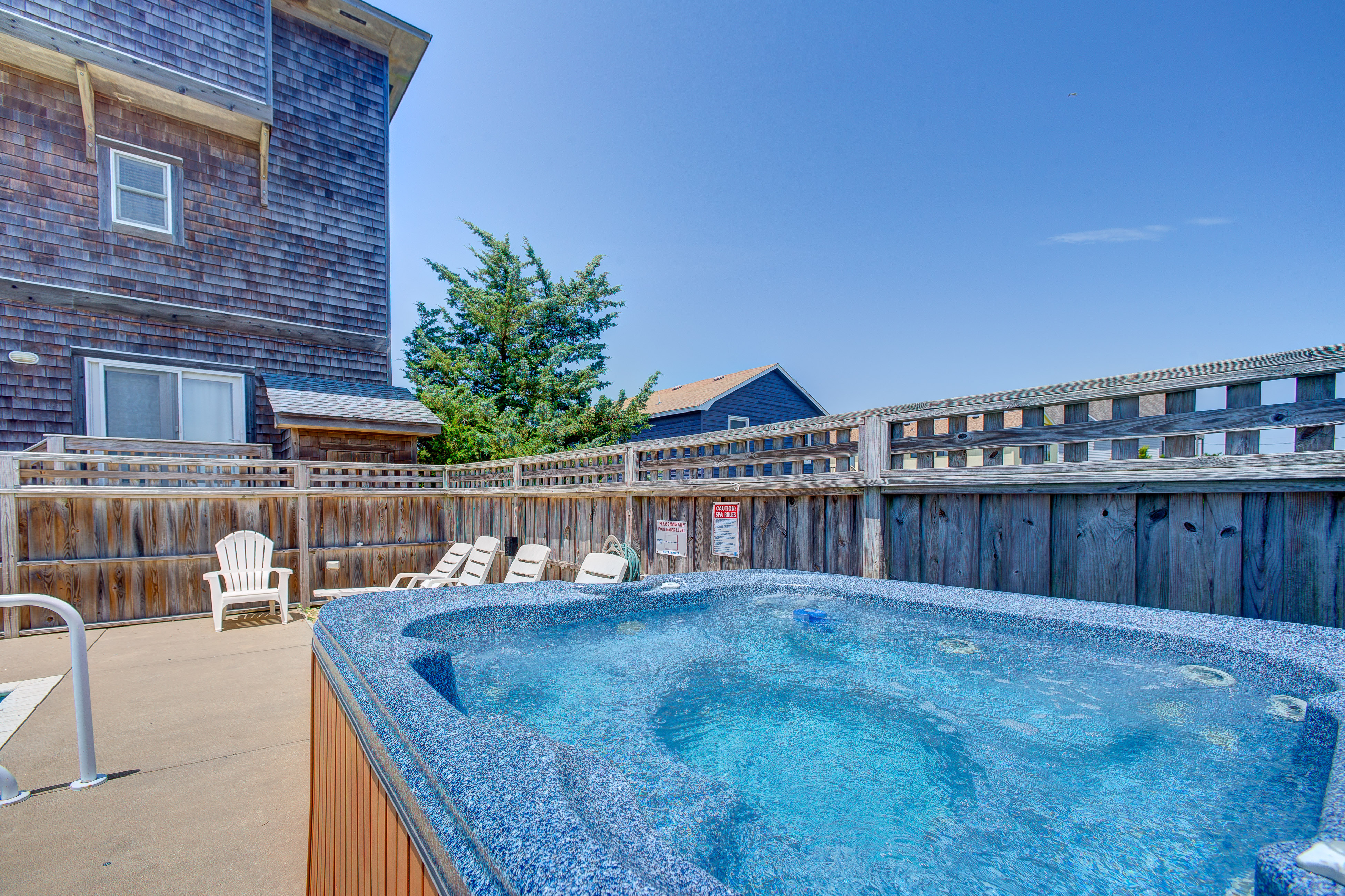 Dog-friendly home with private saltwater pool, hot tub, game room, & fireplace