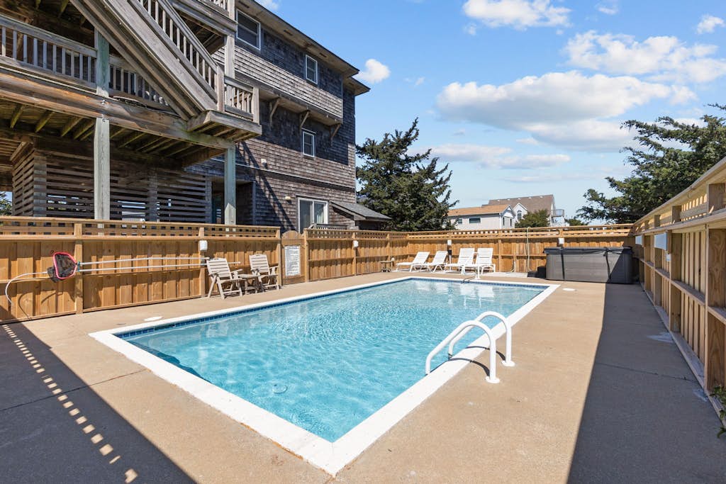 Dog-friendly home with private saltwater pool, hot tub, game room, & fireplace