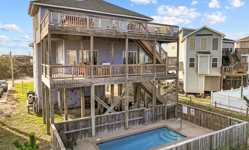 Coastal home with private pool, game room, media lounge, oceanside deck