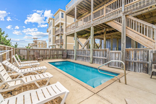 Coastal home with private pool, game room, media lounge, oceanside deck