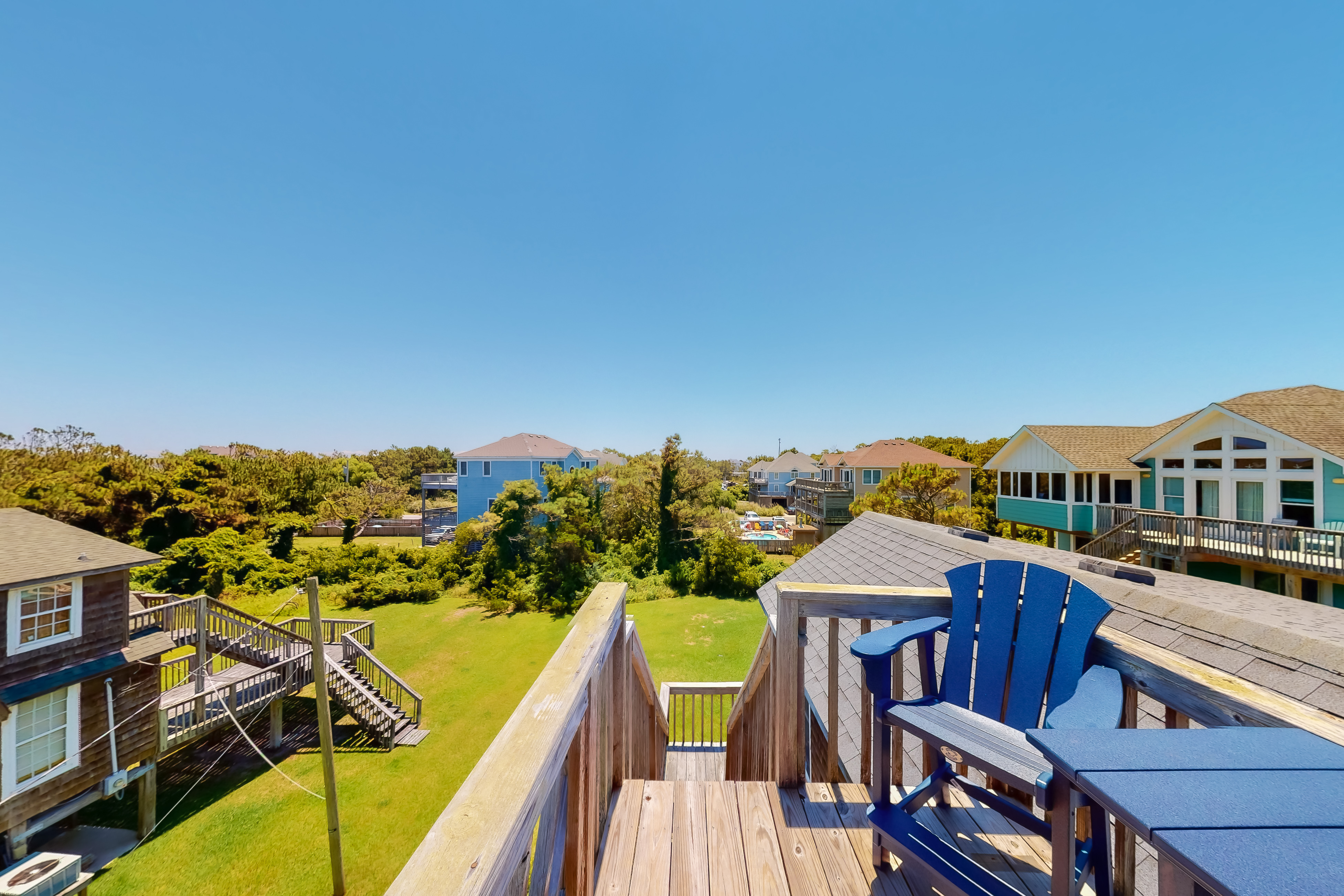 Dog-friendly home steps from beach with yard, multiple decks, and arcade game