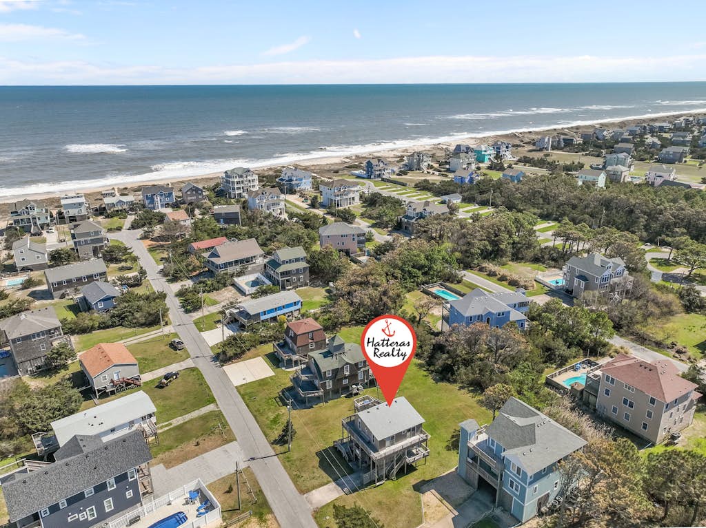 Dog-friendly home steps from beach with yard, multiple decks, and arcade game