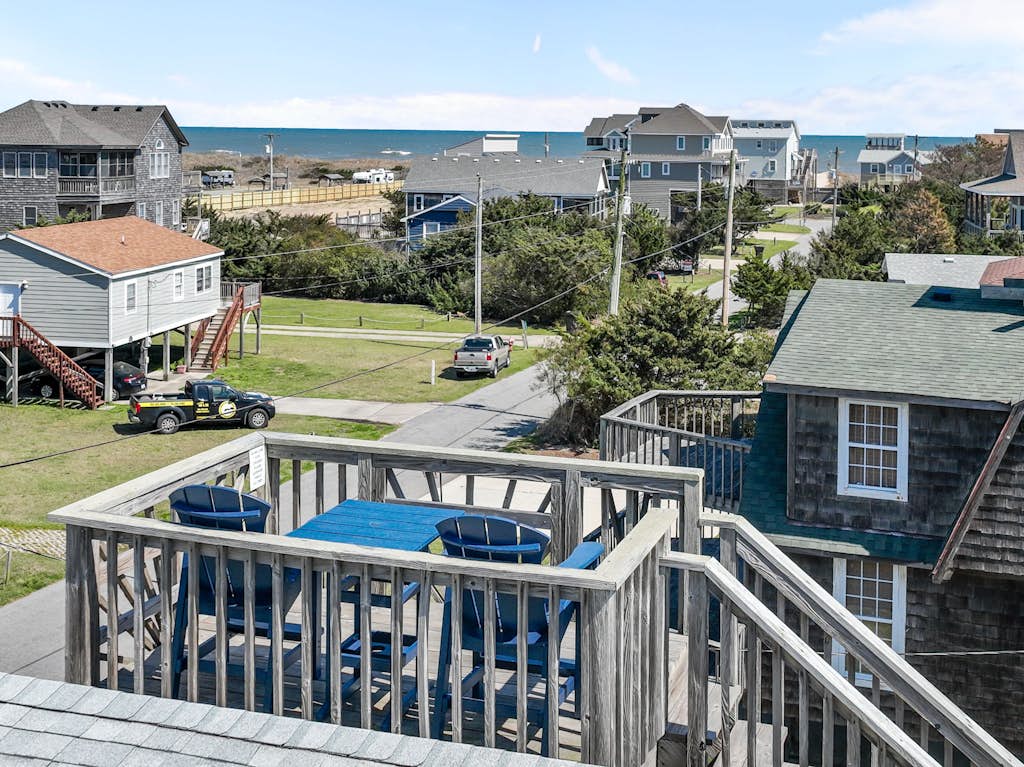 Dog-friendly home steps from beach with yard, multiple decks, and arcade game