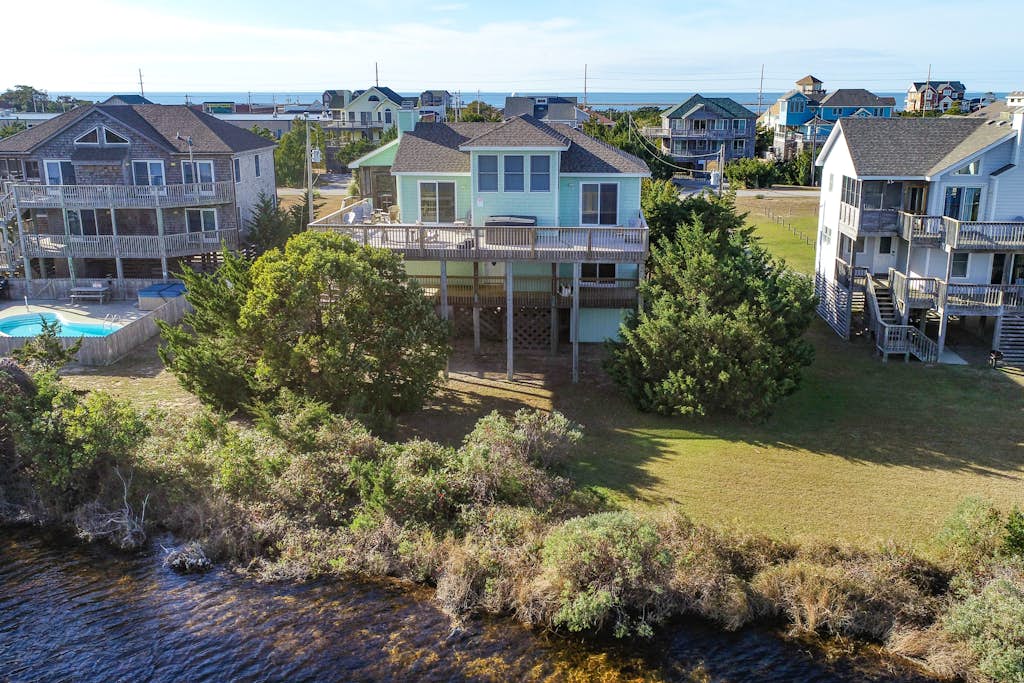 Home on private lake between beach & sound with WiFi, pool & hot tub