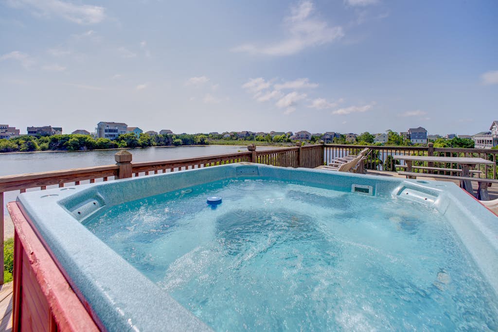 Home on private lake between beach & sound with WiFi, pool & hot tub