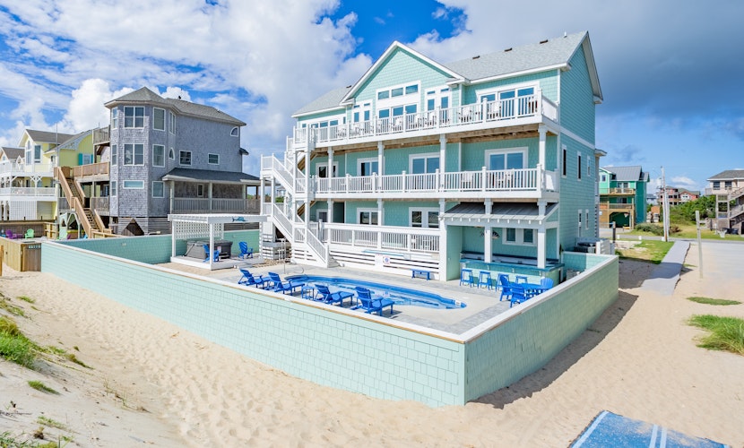 Lovely beachfront home with hot tub, pool, game room, & central AC
