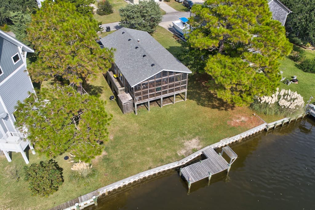 Waterfront home on a scenic canal with a dock, screened porch & fast WiFi