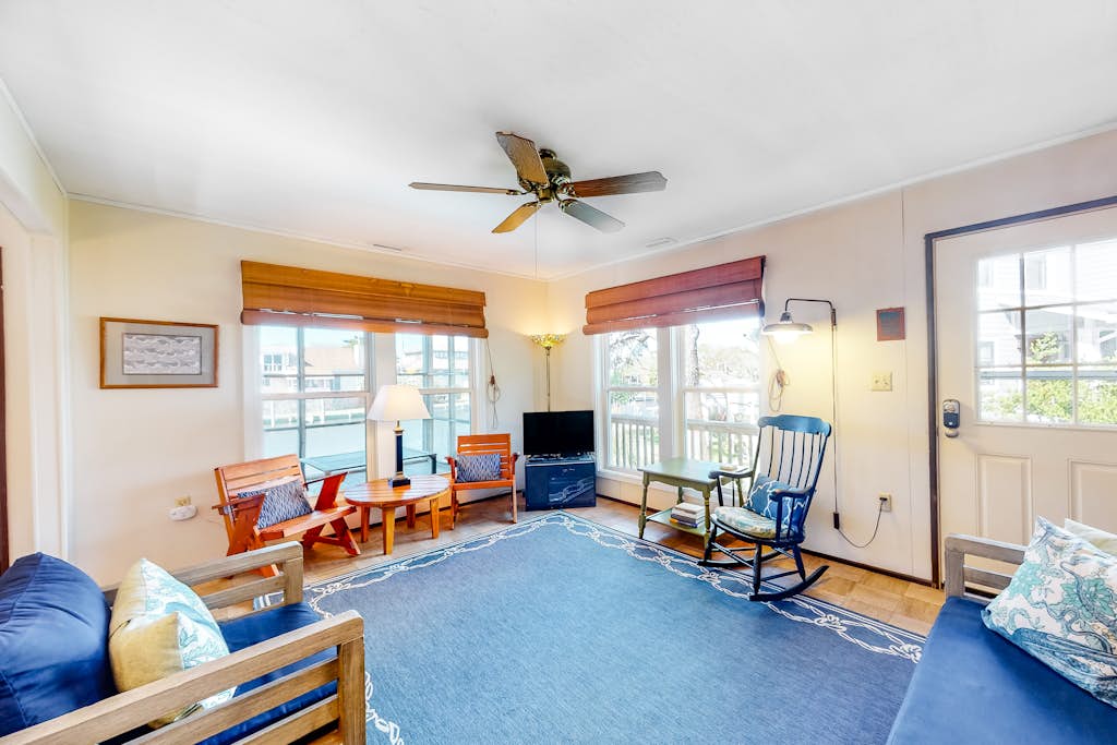 Waterfront home on a scenic canal with a dock, screened porch & fast WiFi