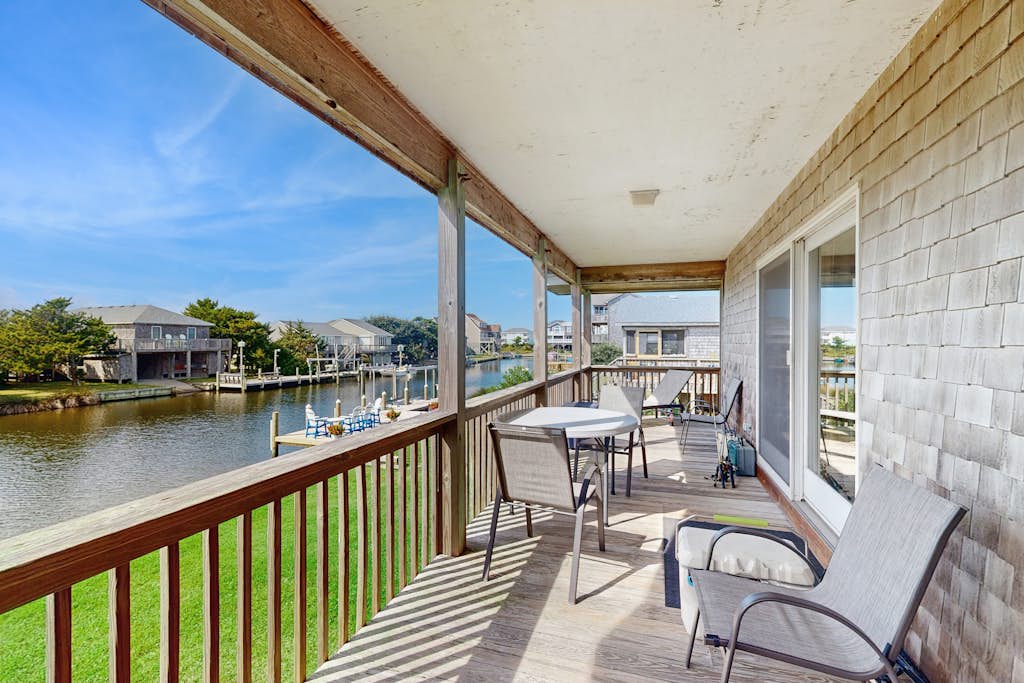 Dog-friendly, canal-front house with dock, balcony, deck, & central AC