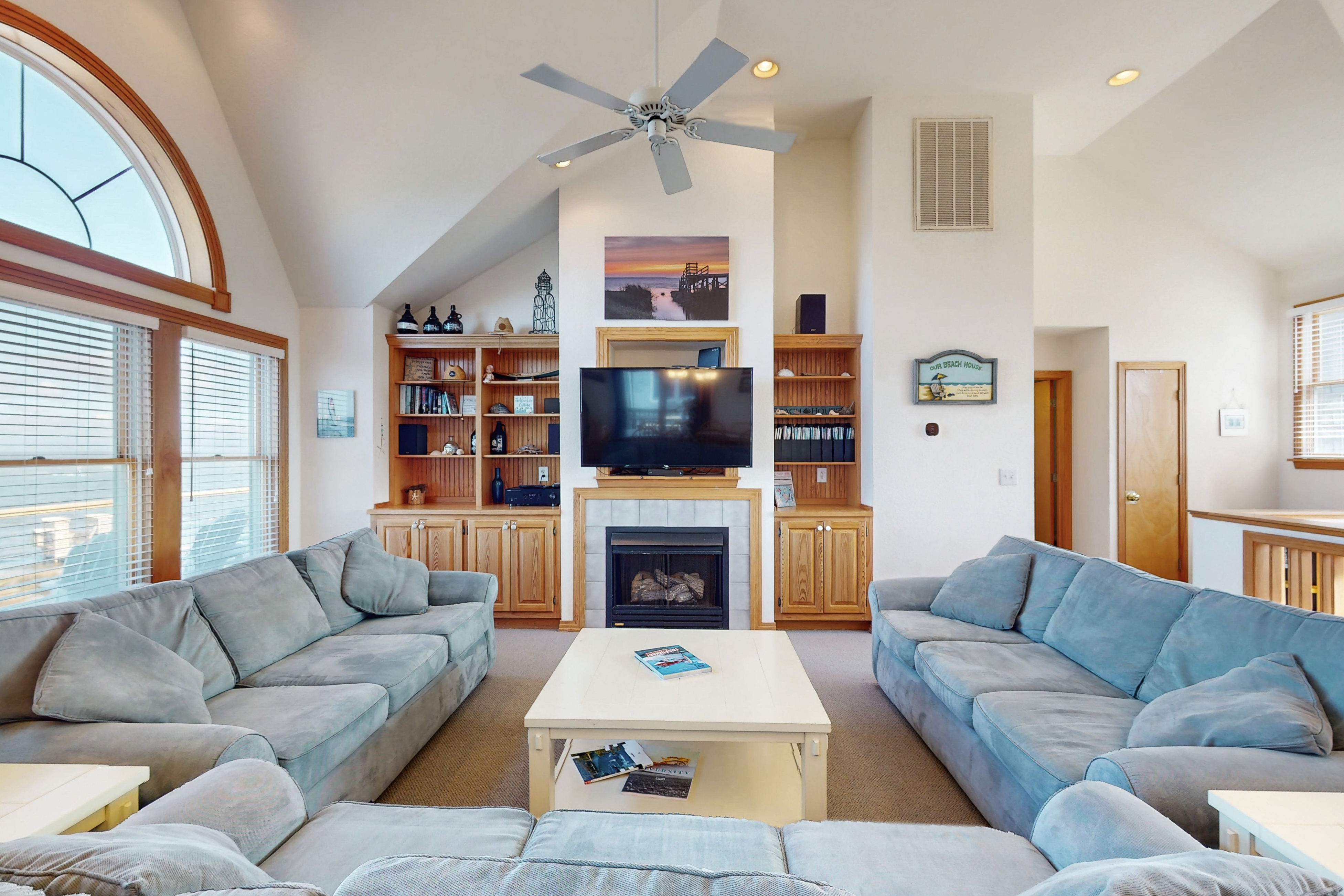 Waterfront home with private hot tub, sound access, fireplace & pool