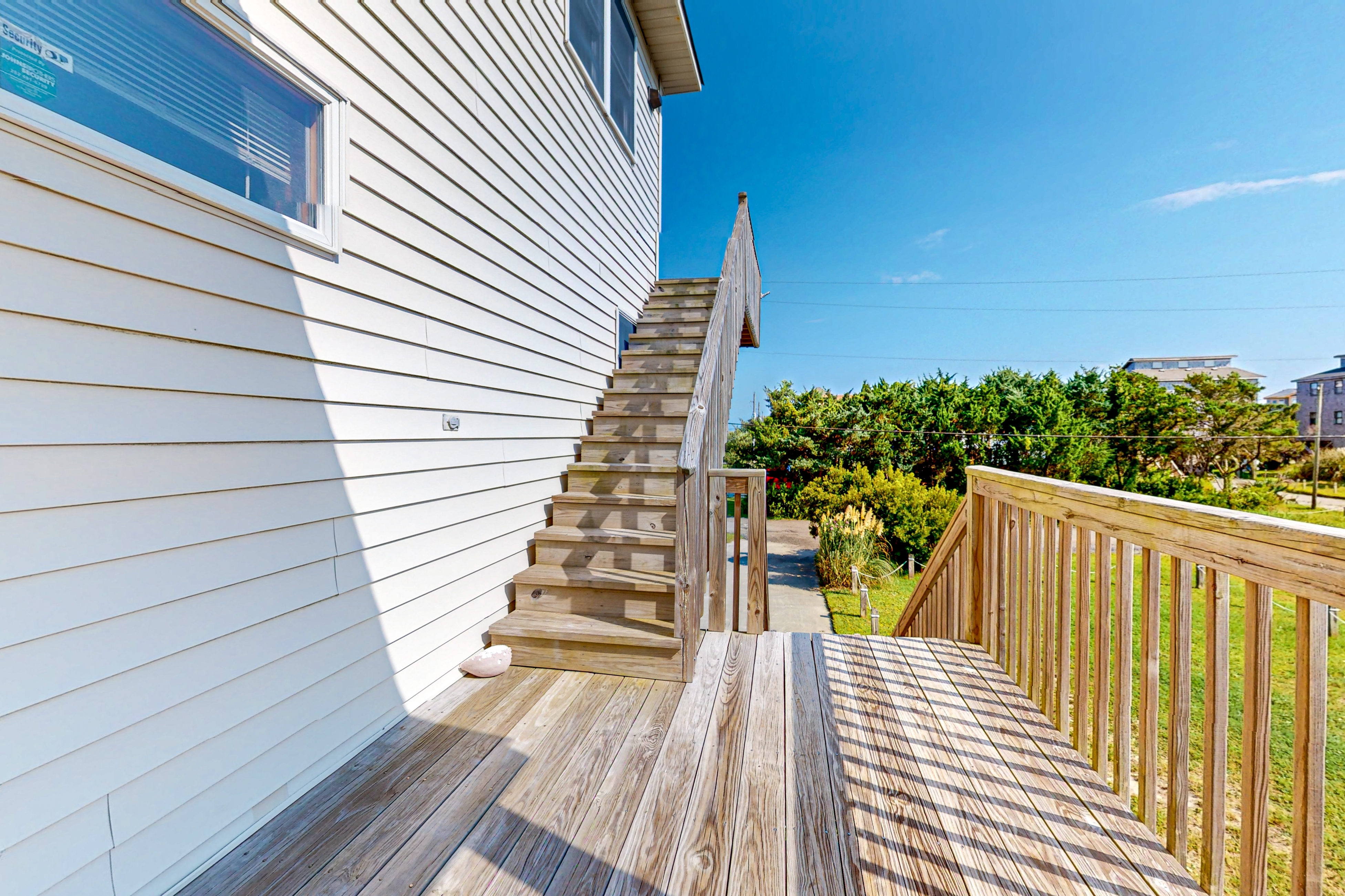 Charming water view home with pool access, decks & outdoor shower - dog-friendly